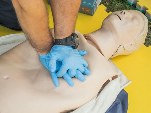Staff member practicing emergency response training