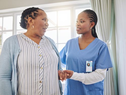 Caregiver greeting a resident
