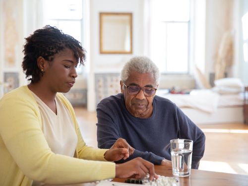 Caregiver giving one-on-one attention to a resident