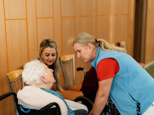 Caregiver speaking warmly with a resident