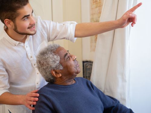 Caregiver attentively engaging with a resident